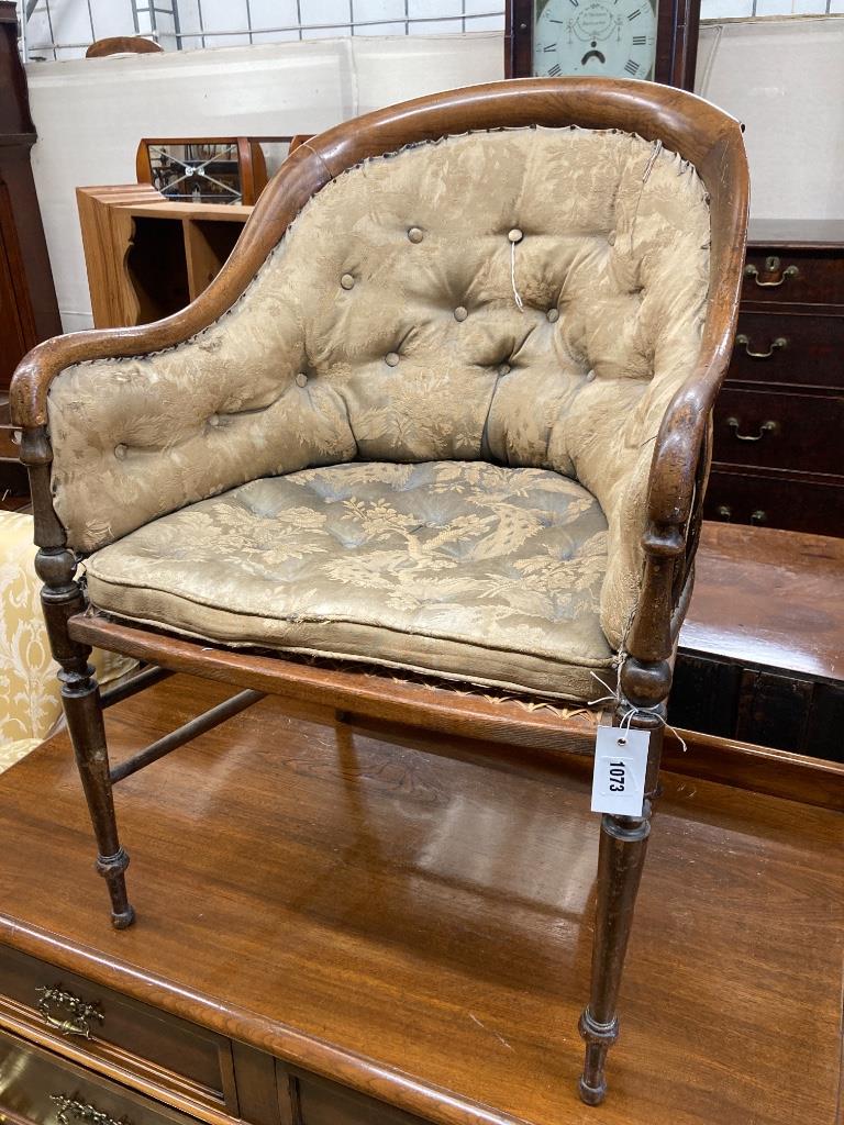A late Victorian walnut caned seat back armchair